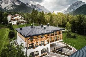 an aerial view of a house in the mountains at Chalet Martina Apartments in San Vigilio Di Marebbe