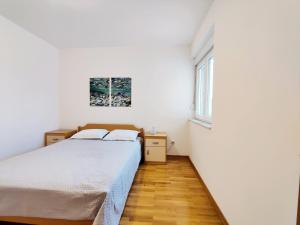 Postel nebo postele na pokoji v ubytování Airy Apt in Tisno - Murter, Beach - 3 Min Walk, 2 bedrooms, 2 bathrooms, 70m2 with terrace, mooring included