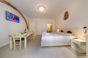 Posteľ alebo postele v izbe v ubytovaní Garden Relais Le Fontanelle