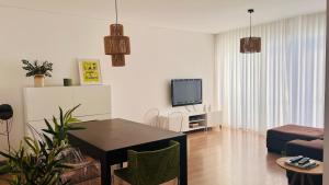 TV a/nebo společenská místnost v ubytování Casa da Babacha