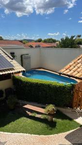 a swimming pool in the backyard of a house at Pousada Remanso in Bonito