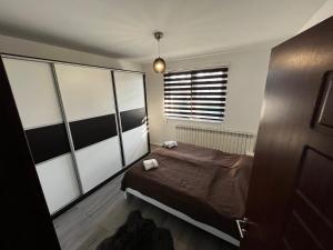Postel nebo postele na pokoji v ubytování Silver Apartment