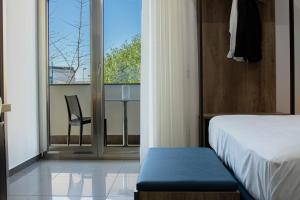 Postel nebo postele na pokoji v ubytování MyHouse Pompei