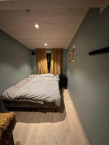 En eller flere senger på et rom på Cabin in Tromsø