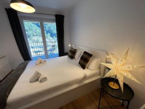 Кровать или кровати в номере Apartamento Premium en Ribasol Ski & Mountain Park