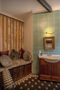 a bathroom with a sink and a tub and a sink at Medieval Manor in Caldicot