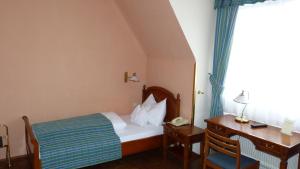 Postel nebo postele na pokoji v ubytování Hotel Apartment Rothensteiner