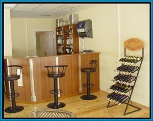 a wine tasting room with a rack of wine bottles at Montenegro Inn in Baku