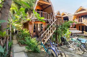 a group of bikes parked in front of a house at Deep House Bungalows in Gili Trawangan