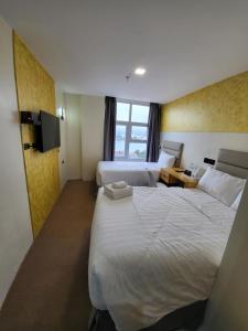 Letto o letti in una camera di Sempre Premier Inn - MACTAN AIRPORT HOTEL