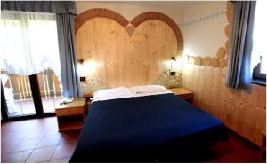 Postel nebo postele na pokoji v ubytování Maso La Vecchia Quercia