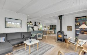 a living room with a couch and a fireplace at Gorgeous Home In Børkop With Kitchen in Børkop