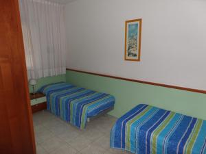 Un pat sau paturi într-o cameră la Villa Felice