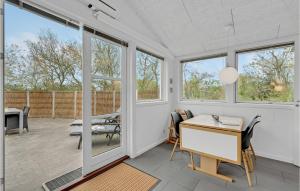 a home office with a desk and windows at Holiday Home Ildervej Yellow in Hemmet