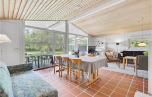 a kitchen and living room with a table and chairs at Beautiful Home In Humble With Kitchen in Humble