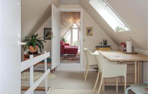 a kitchen and dining room with a skylight at Beautiful Apartment In Nex With Wifi in Neksø