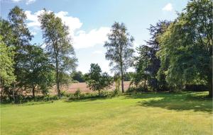 a large field with trees in the background at Amazing Home In Tikb With Kitchen in Tikøb