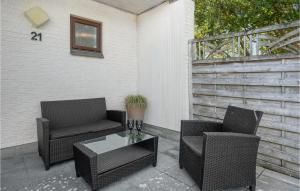 two chairs and a coffee table on a patio at Cozy Apartment In Rømø With Kitchen in Rømø Kirkeby +17 photos