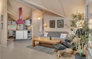 a living room with a couch and a table at 2 Bedroom Beautiful Home In Slagelse in Slagelse