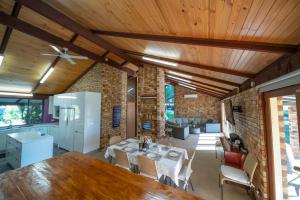 a kitchen and living room with a table and a dining room at Blickinstal Holiday Retreat in Bethany