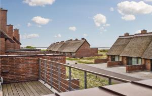 a row of brick buildings with thatched roofs at Two-Bedroom Holiday Home Rømø With A Fireplace 03 in Rømø Kirkeby