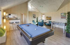 a living room with a pool table in it at Nice Home In Bogense With Kitchen in Skåstrup