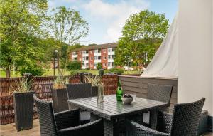 a patio with a table and chairs and a building at Beautiful Apartment In Helsingr With Wifi in Helsingør