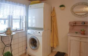 a washing machine in a kitchen with a window at Lovely Home In Give With House A Panoramic View in Give