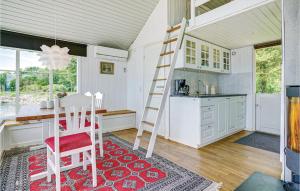 a kitchen with a ladder in the middle of a room at Awesome Home In Broager With 2 Bedrooms And Wifi in Skelde