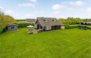 an aerial view of a house with a large yard at Stunning Home In Tarm With Kitchen in Hemmet