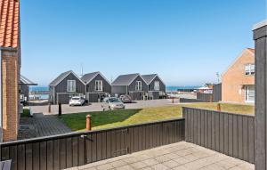 a view from a balcony of houses and the ocean at Gorgeous Home In Tranekr With Kitchen in Tranekær