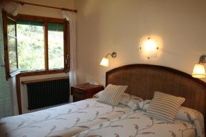 Un pat sau paturi într-o cameră la Hotel Casa Peix