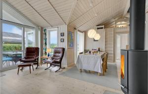 a living room with a table and chairs at Lovely Home In Faaborg With Wifi in Fåborg