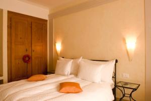 Postel nebo postele na pokoji v ubytování Romantik Hotel Landhaus Liebefeld