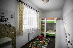 Postel nebo postele na pokoji v ubytování Hotel Na Farmě Choťovice