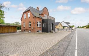 a house on the side of a road at Six-Bedroom Holiday Home In Bagenkop in Bagenkop