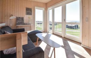 a living room with a couch and a table at Mosegården in Fåborg