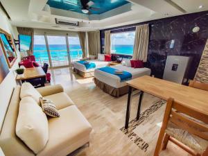 a living room with a view of the ocean at Paradise Beachfront & Nightlife Heart in Cancún