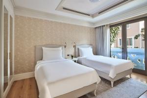 Postel nebo postele na pokoji v ubytování Club Privé By Rixos Saadiyat