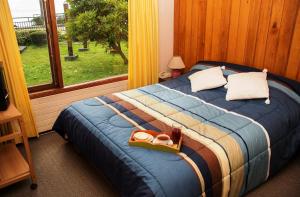 Cama o camas de una habitación en Cabañas Lagosur
