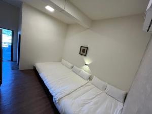 Una cama o camas en una habitación de XingYe B&B