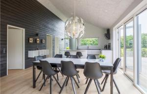 a dining room with a table and chairs at Lovely Home In Toftlund With Wifi in Toftlund