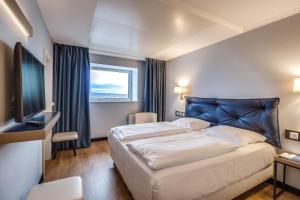 Postel nebo postele na pokoji v ubytování Congress Hotel Chemnitz + 37 fotografií