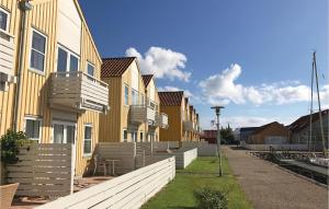 a row of houses on the side of a street at Two-Bedroom Apartment In Rudkobing in Rudkøbing