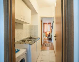 Kuchyň nebo kuchyňský kout v ubytování Sweet Dreams Apartments