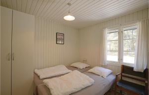 Postel nebo postele na pokoji v ubytování Dueodde Ferieby