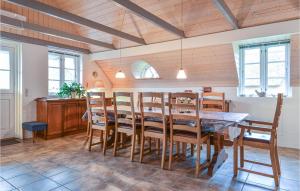 a dining room with a table and chairs at Lovely Home In Ulfborg With Kitchen in Øhuse