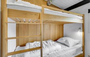 a bedroom with two bunk beds with white sheets at Nice Home In Roskilde With 2 Bedrooms And Wifi in Roskilde