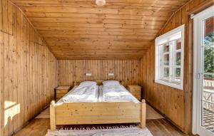 Postel nebo postele na pokoji v ubytování Strandly