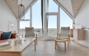 a living room with a table and chairs at Hasle Marina in Hasle